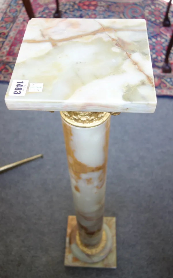 A Victorian style onyx and gilt metal mounted pedestal, of Corinthian column form, 90cm high.
