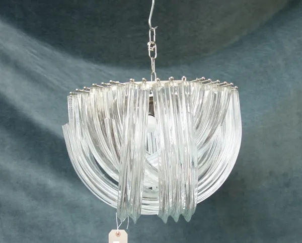 A pair of Italian glass chandeliers, circa 1970, each with silvered hexagonal frame supporting three graduated rows of shaped glass rods, approximatel