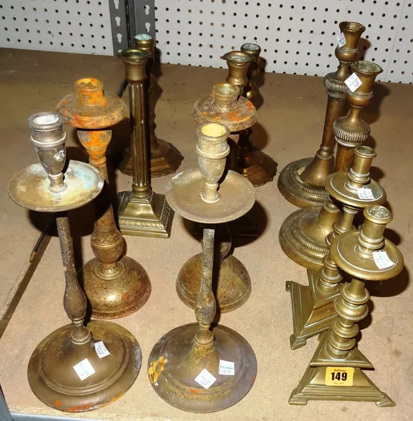 Collectables, including; a group of 18th century and later bronze and brass candlesticks, comprising six pairs, (12).   S4B