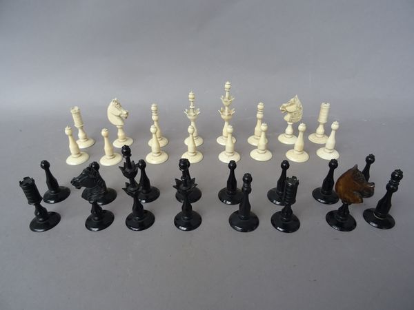 An ivory chess set, central European, 19th century, the king of turned baluster form with double crown carving to the stem, king 7cm high with a foldi