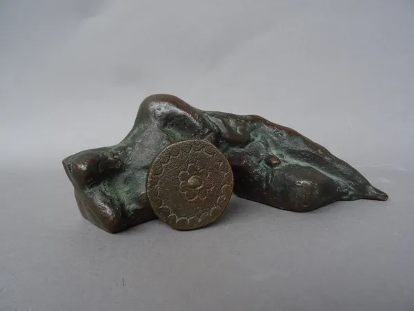 A bronze figure depicting a recumbent male nude with a shield, late 20th century, limited edition 16/50, signed with initials- possibly YP, 20cm wide.