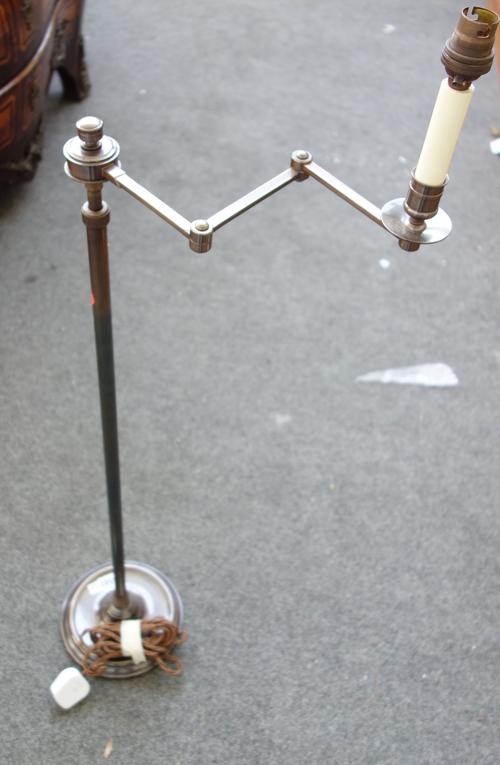 Three Edwardian style silvered metal adjustable floor lamps with zig-zag three piece arm on a loaded circular base. (100cm high reduced) (3).