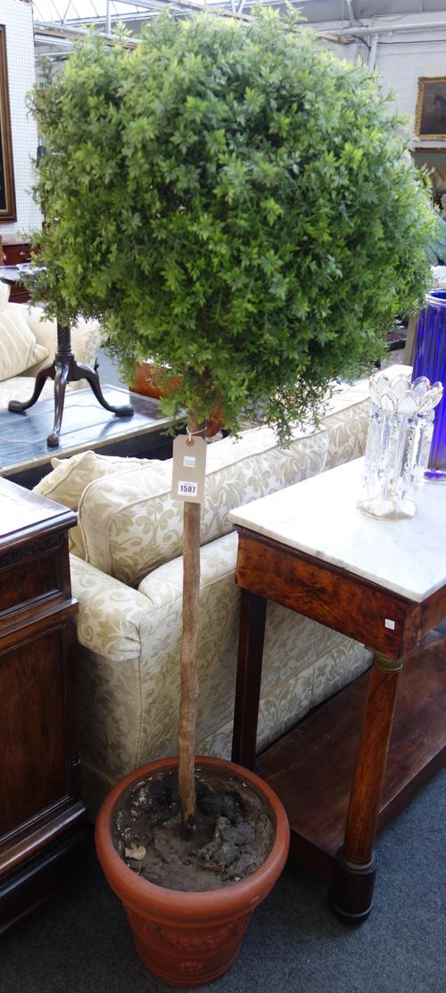 A pair of faux box hedges of lollipop topiary form, in faux terracotta conical pots, 180cm high, (2).