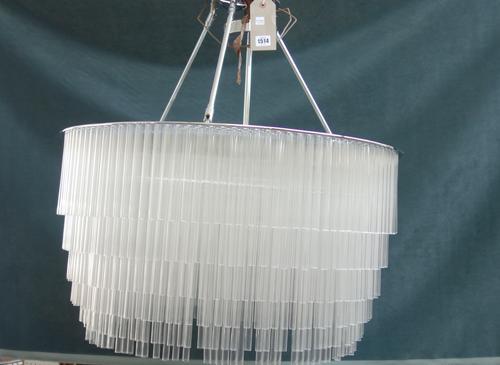 A Tom Kirk glass and chrome chandelier, modern, the circular frame suspending hundreds of clear glass tubes surrounding an internal six light fitment