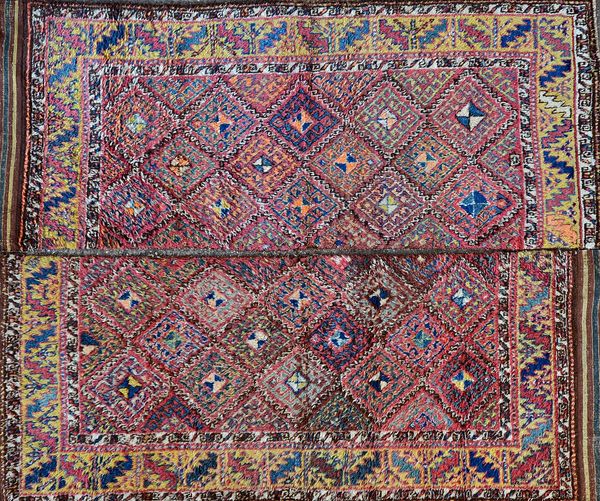 An Uzbek Julkhyrs carpet, cut, the polychrome field with diamonds, a saffron leaf border, 240 x 100cm and 240 x 97cm (2).  Illustrated