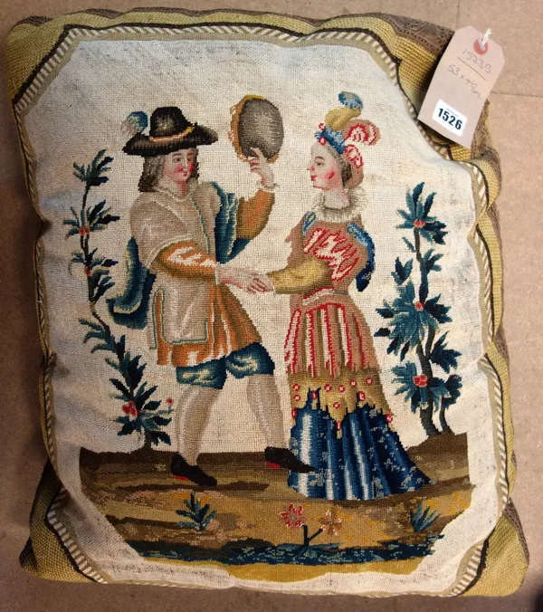 An early George III needlework cushion, woven as a dancing couple, he holding a tambourine, 53cm x 46cm.  Illustrated