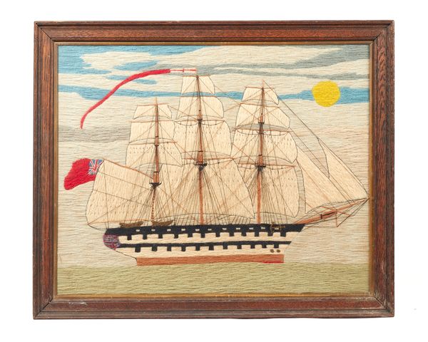 A polychrome ship woolwork picture, detailed as a fully rigged British war ship at full sail, framed and glazed, 55cm x 44cm.  Illustrated