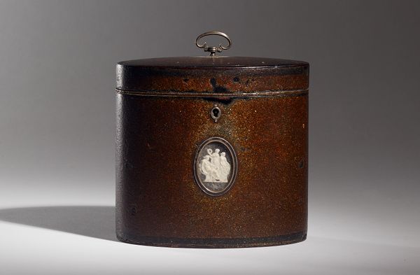 Attributed to Henry Clay; a George III oval tea caddy with ground mother-of-pearl and lacquer finish (Nashiji) and opposing vignettes depicting classi
