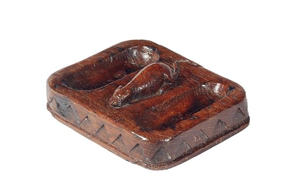 Robert 'Mouseman' Thompson; a carved oak twin section pin dish/ashtray, centred by a recumbent mouse, above a diamond tooth carved frieze, 13.5cm wide
