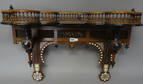An early 20th century North African bone and mother-of-pearl inlaid hardwood double bowfront wall bracket, with spindle turned decoration, 80cm wide x