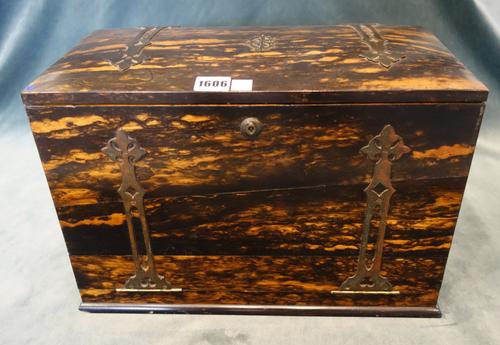 A late Victorian Gothic Revival strapwork mounted coromandel travelling writing box, the lift top and fold-out front revealing a fitted interior with