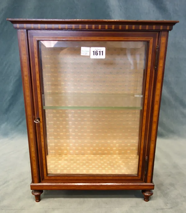 A late 19th century miniature/table top satinwood banded mahogany vitrine, with single bevelled glazed door and sides on turned feet, 33.5cm wide x 44
