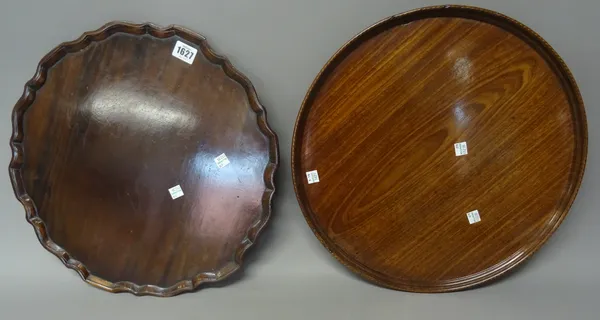A George III dished mahogany circular serving tray with inlaid rim, 42cm diameter, together with a late 18th century mahogany pie-crust occasional tab