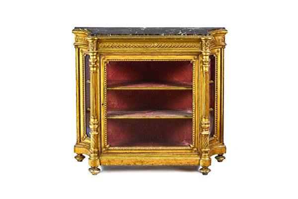 A mid-19th century French display cabinet, the shaped marble top over a gilt framed single door base, flanked by swept sides divided by fluted columns