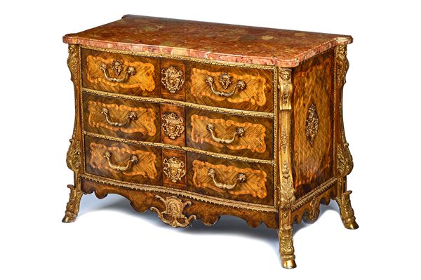 A Louis XIV style commode, the shaped marble top with outstepped rounded corners, over a gilt metal mounted parquetry and marquetry serpentine three d