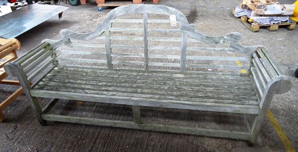 A 20th century Lutyens style hardwood garden bench, with slatted seat and block supports, 230cm wide x 106cm high.