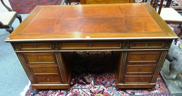 A 19th century French brass bound mahogany pedestal desk, with seven drawers about the knee, on bun feet, 145cm wide x 80cm high x 80cm deep.