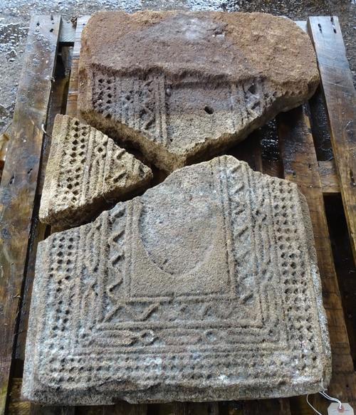 Three pieces of a carved sandstone panel, probably Indian, 18th century, with arch and wriggle work decoration (further parts missing), the largest 62