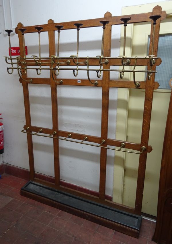 A Gothic Revival brass mounted oak hat, coat and umbrella stand, 149cm wide x 199cm high.