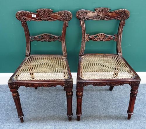 A set of six mid-19th century Anglo-Indian carved rosewood framed dining chairs, with cane work seats, each 49cm wide x 86cm high, (6).Note: this lot