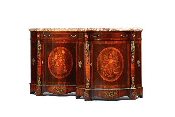 A pair of mid-19th century French style side cabinets, each with serpentine marble top over a gilt metal mounted parquetry inlaid mahogany base, with