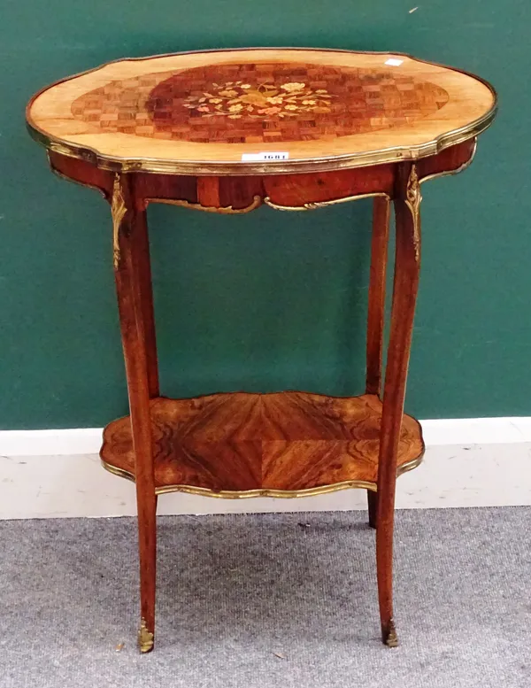 A Louis XV style French gilt metal mounted rosewood and parquetry inlaid oval occasional table, circa 1910, 56cm wide x 73cm high x 35cm deep.