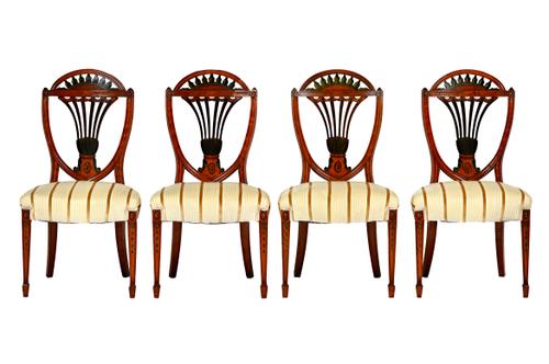 A set of four Hepplewhite style polychrome painted satinwood dining chairs, circa 1900, each with open fan flat back and bow seat, on tapering square