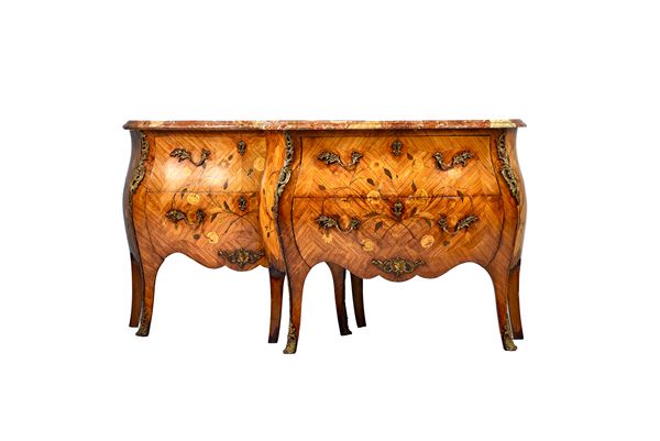 A pair of Louis XV style commodes, each with serpentine marble top over a gilt metal mounted floral marquetry inlaid bombé Kingwood two drawer base, o