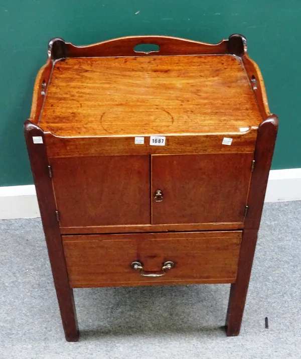 A George III mahogany night commode, the pierced tray top over pair of cupboards and drawer, on square supports, 54cm wide x 77cm high x 46m deep.