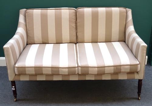 A Regency style square back sofa, with downswept arms on stained beech turned supports, 151cm wide x 90cm high x 90cm deep.