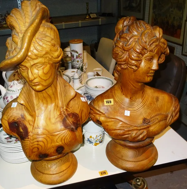 A 20th century pitch pine carved bust of a woman and another, (2).  G5