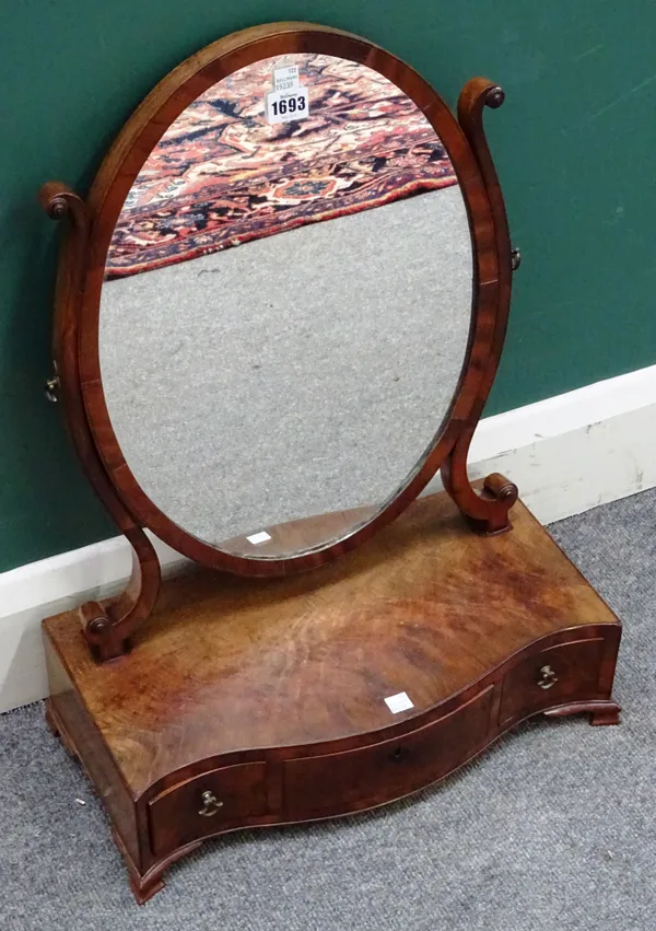 A George III mahogany toilet mirror, with serpentine three drawer base, on pointed ogee bracket feet, 45cm wide x 59cm high