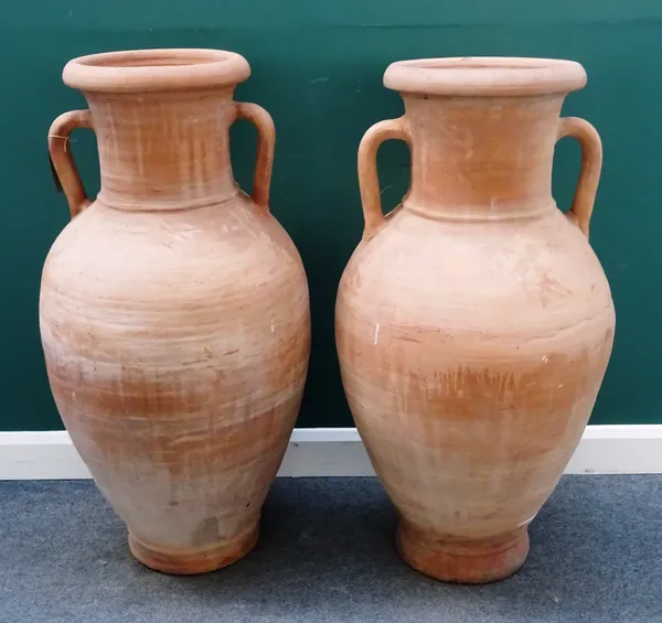 A pair of modern terracotta garden urns of amphora shape, 60cm wide x 125cm high.