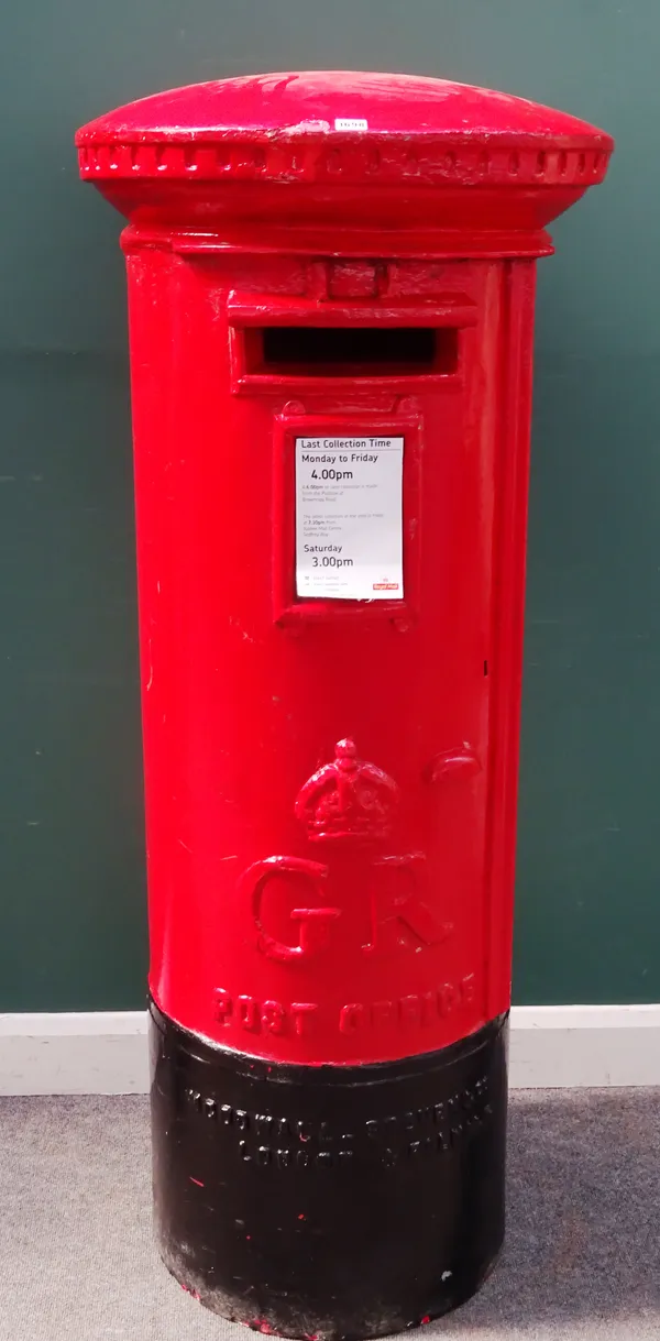 A fibreglass 1.1 scale model of a Royal Mail George IV circular postbox, 65cm diameter x 160cm high.