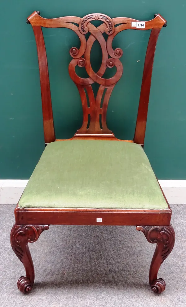 A George III mahogany dining chair, with paper scroll crest rail and interlaced splat over straight front drop-in seat, on scroll supports, 58cm wide