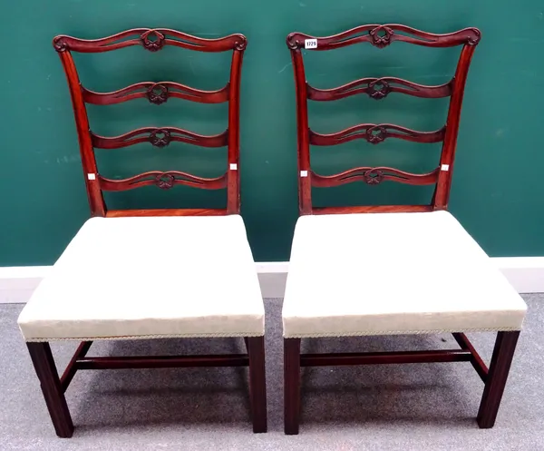 A pair of George III mahogany ribbon back dining chairs, with straight front seat on channelled square supports, each 57cm wide x 95cm high, (2).