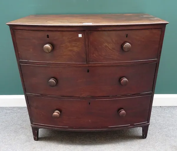 A Regency mahogany bowfront chest of two short and two long graduated drawers, on bracket feet, 102cm wide x 97cm high x 60cm deep.