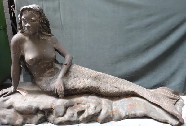 A hollow cast bronze figure of a recumbent mermaid, signed 'ROSSI', 193cm wide x 100cm high.