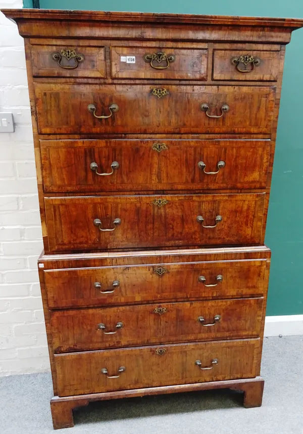 A George II figured walnut chest on chest, with three short over six long graduated drawers, on bracket feet, 105cm wide x 177cm high x 53cm deep.