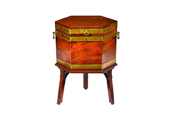 A George III brass bound mahogany hexagonal cellarette on stand, the stand with three channelled square supports, 53cm wide x 66cm high.  Illustrated
