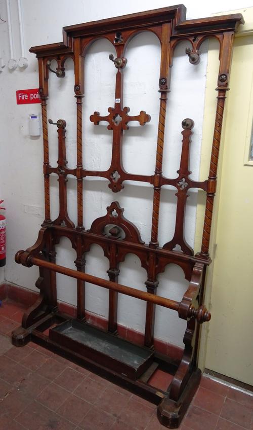A 19th century Gothic Revival oak hall stand, with spiral fluted and pierced quatrefoil decoration, 142cm wide x 210cm high.