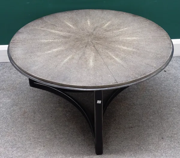 A 20th century circular coffee table, with faux shagreen radial veneered top on three box metal supports, united by concave stretcher 96cm diameter x