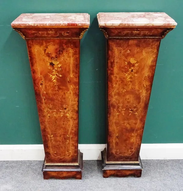 A pair of 18th century style pedestals, each with marble top over a gilt metal mounted marquetry inlaid tapering square column, on a shaped plinth bas
