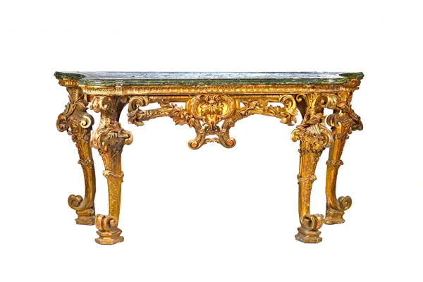 A mid-18th century style console table, the serpentine faux marble top over a gilt base with pierced frieze, centred by a cartouche, on four foliate m
