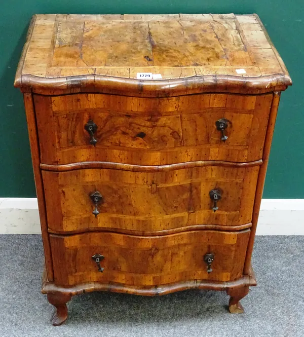 A small 18th century German walnut commode, with three serpentine drawers on later squat cabriole supports, 60cm wide x 78cm high x 38cm deep.   8.3