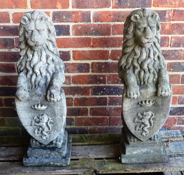 A set of four reconstituted stone sejant lions, on stepped square bases, 23cm wide x 80cm high, one (a.f), (4).