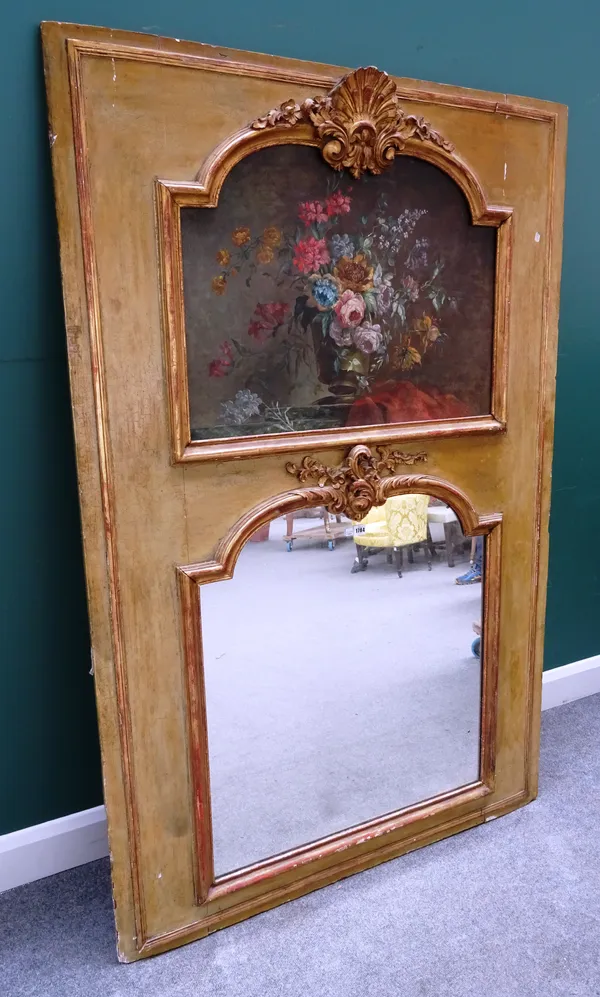 A Louis XV trumeau wall mirror, with later floral oil on panel above arch top mirror plate, both with shell and acanthus  scroll crest and moulded gil