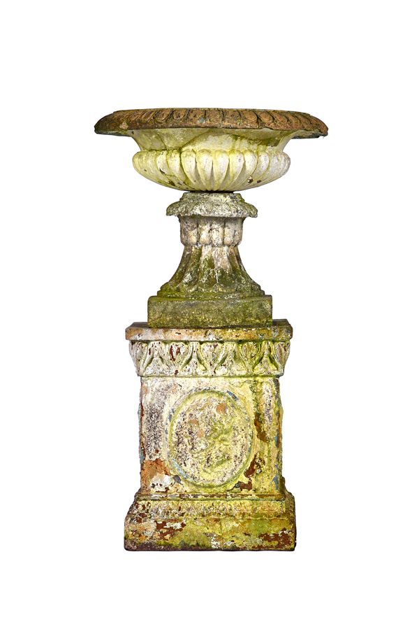 A 19th century Scottish white painted stone ware garden urn, with fluted body and socle, on square base, relief cast with a portrait of Robert Burns,
