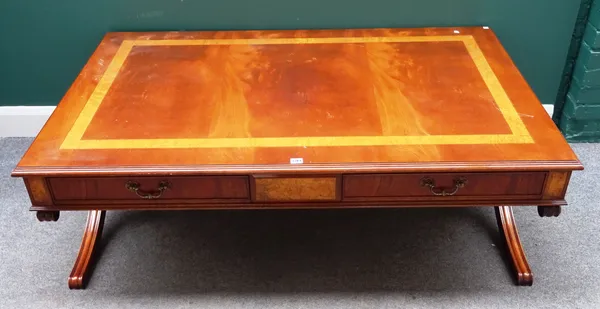 A 20th century mahogany and figured elm rectangular coffee table, with pair of frieze drawers and dummy verso, on 'X' framed supports, 150cm wide x 51