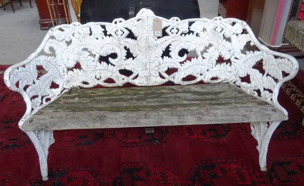 After Coalbrookdale; a white painted 19th century cast iron garden bench, in the fern and blackberry pattern, with slatted wooden seat, 160cm wide x 8